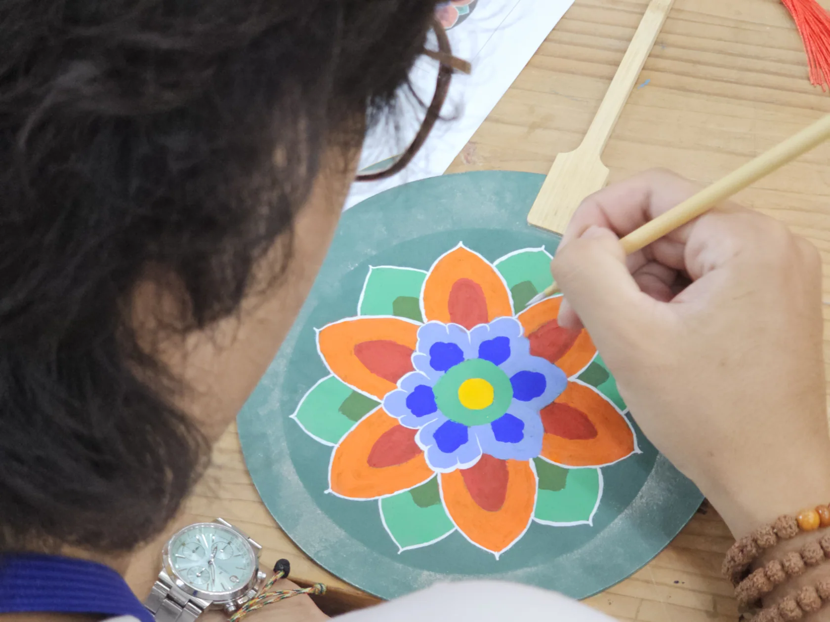A paper fan taking shape