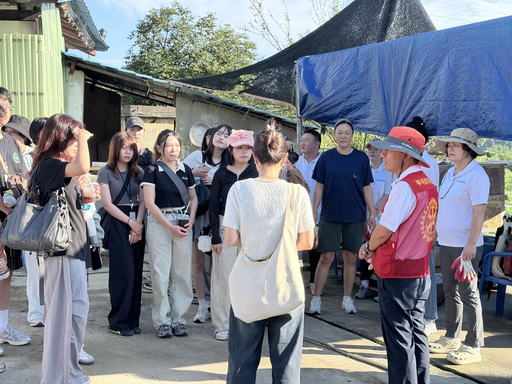 Listening to the briefing before painting the mural